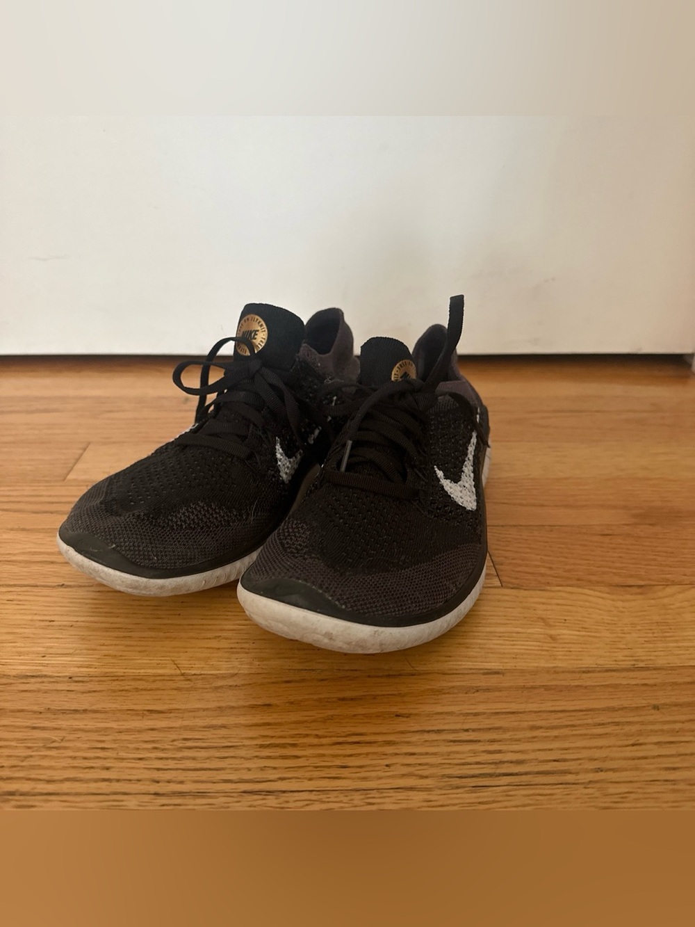 Nike Black Women's Flyknit Sneakers with White Swoosh